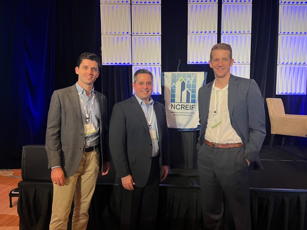 Taylor Green, Keith Darin and Doug Ticus pose for a photo at NCREIF's Fall Conference in Orlando.